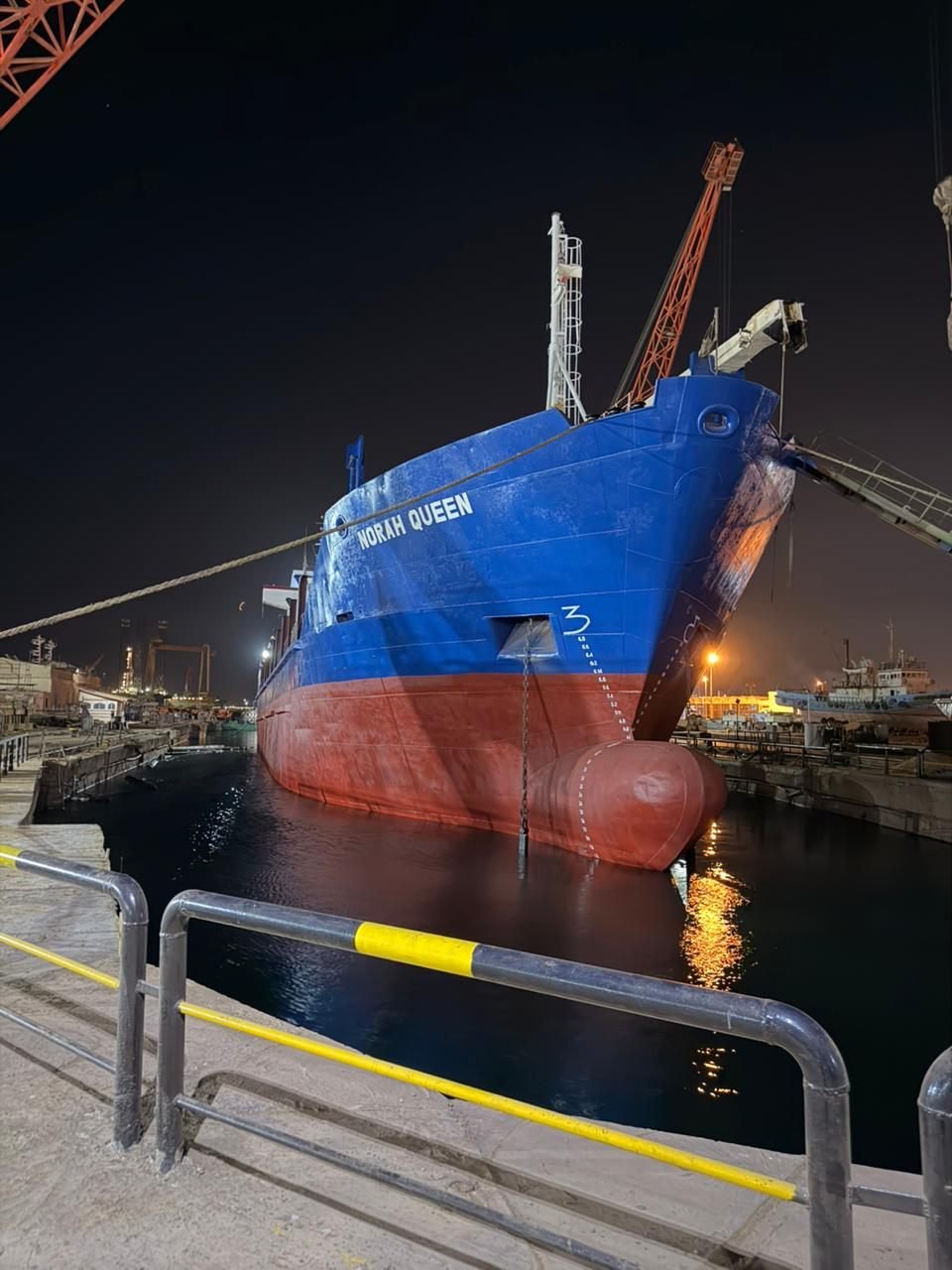 MV Norah Queen in dry dock at night showing the bulbous bow